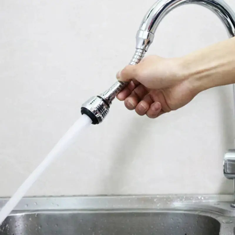 A chrome flexible kitchen faucet extension tube with a sleek chrome finish and black rubber decorbites kitchen faucet seal