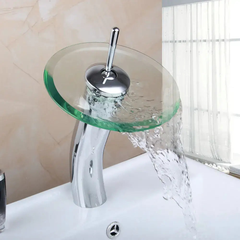 Chrome glass waterfall faucet with transparent green glass disc and sleek curved spout for bathroom sink mixer