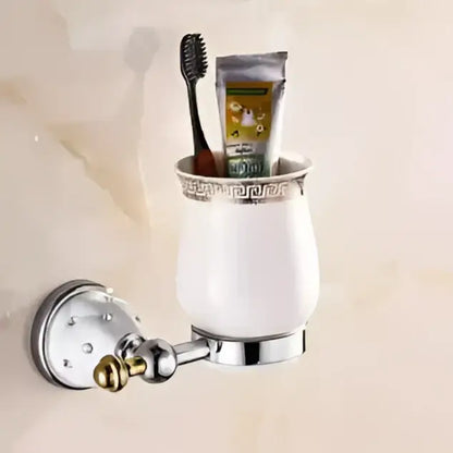 White ceramic toothbrush holder with silver metallic rim and Greek key pattern from decorbites bathroom hardware set