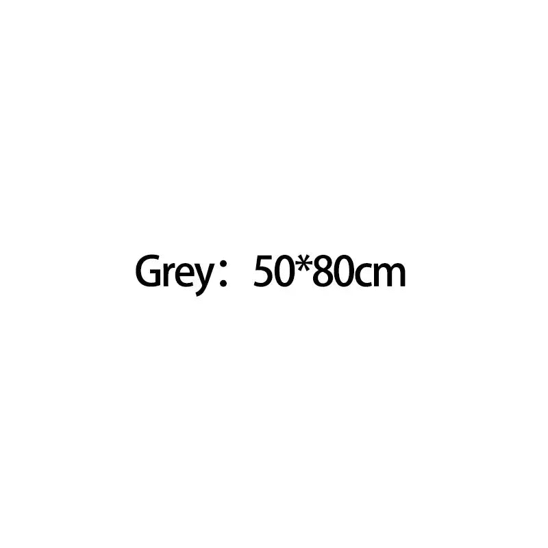 Grey rectangular mat 50 by 80 centimeters for use with chrome high pressure water saving shower head with filter