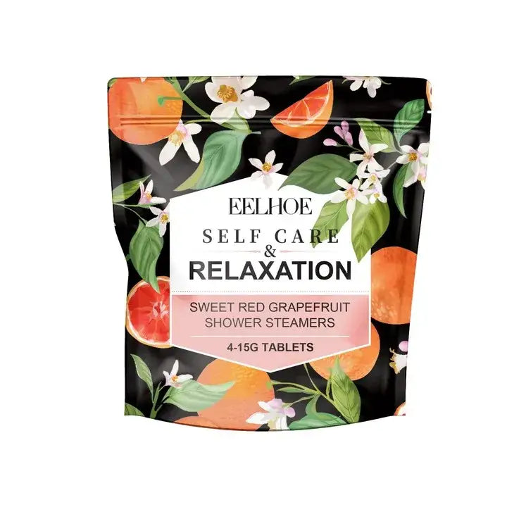 A black resealable pouch with floral citrus design labeled feelhoe sweet red grapefruit shower steamers beside chrome high pressure water saving shower head with filter