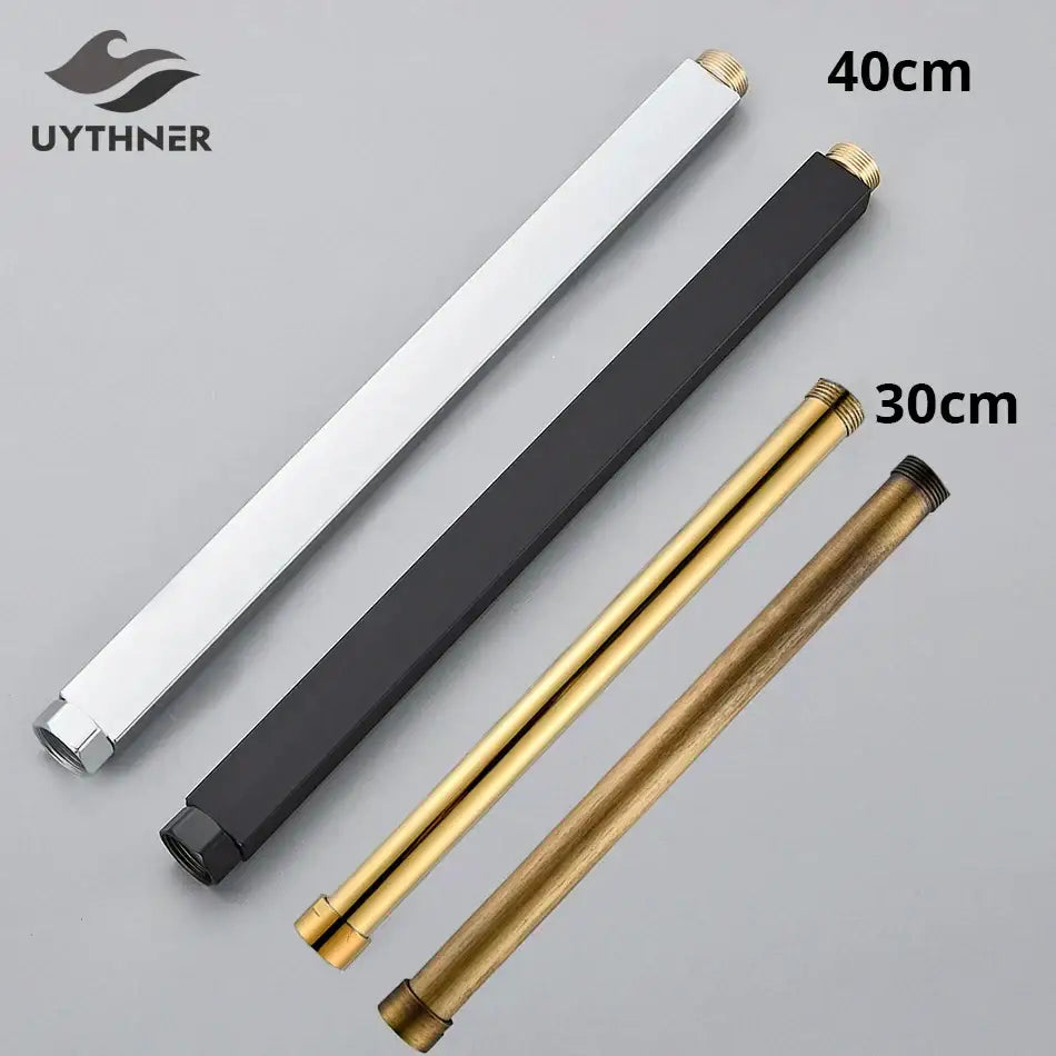 Set of four matte finish brass faucet extension tubes in white black and gold tones with threaded ends for shower faucet extension