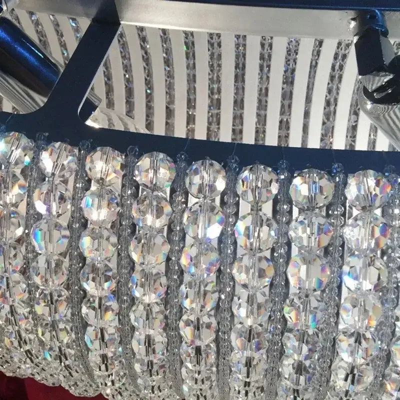 A chrome round crystal chandelier with faceted clear beads and silver-toned metal accents for living room decorbites chrome round