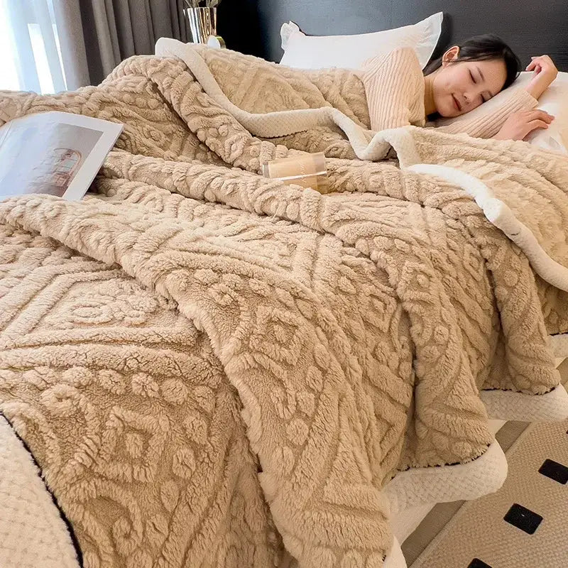 Beige plush throw blanket with raised geometric pattern made of soft coral fleece for cozy bedroom use