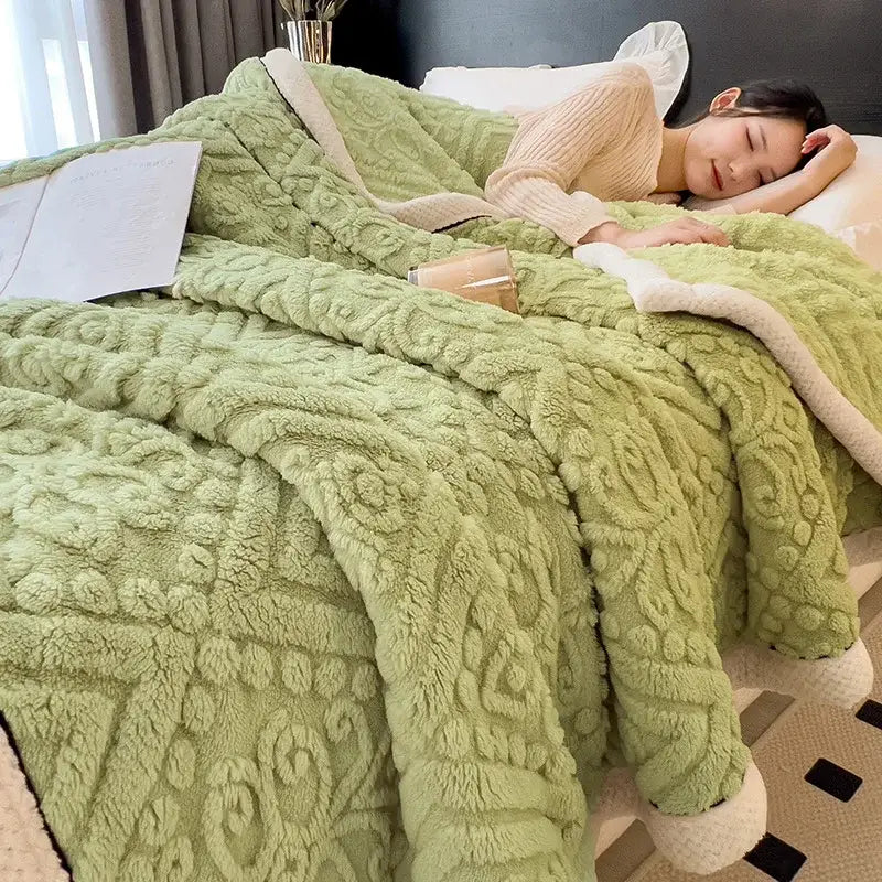 Chunky knit cream and black coral fleece blanket with soft mint green plush throw and textured floral pattern lining
