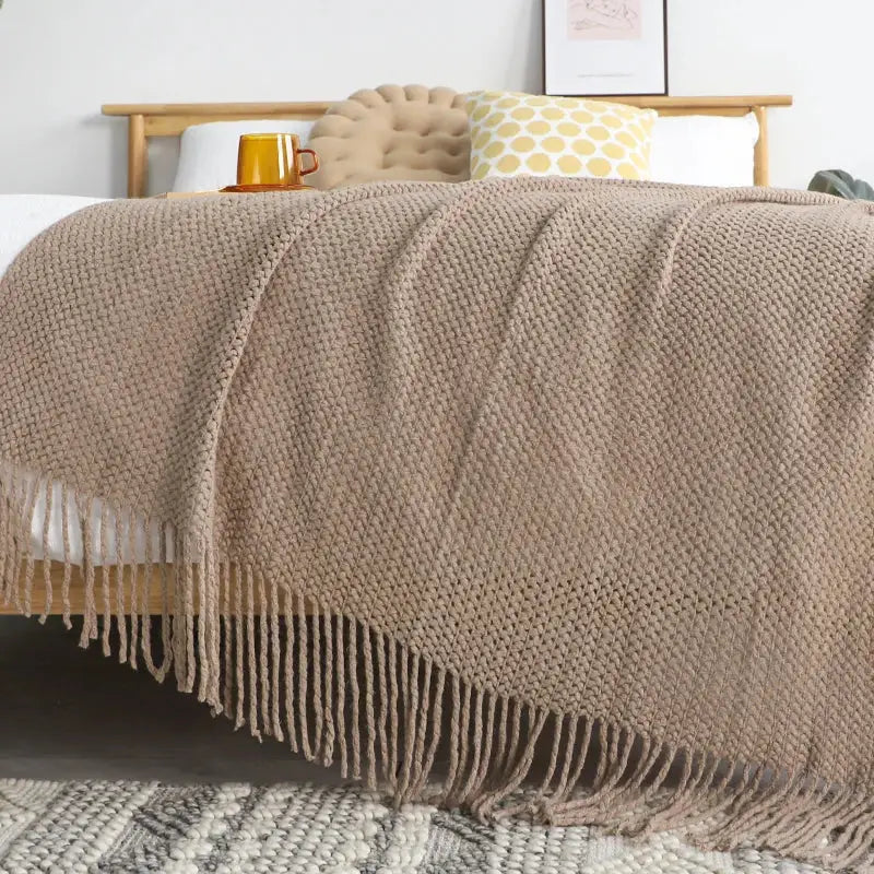 Beige chunky knitted leisure blanket throw with textured weave and tassels for bedroom and living room decorbites decor