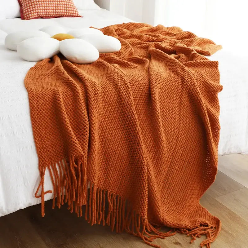 Warm orange chunky knitted leisure blanket throw with textured weave and tassels for bedroom and living room decorbites decor