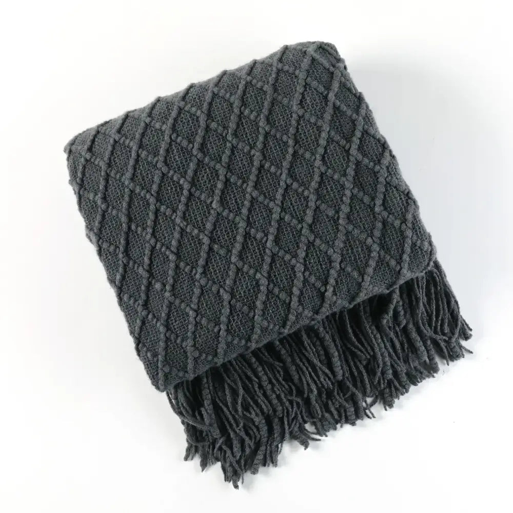 Dark gray cozy knitted sofa throw blanket with diamond pattern and fringe perfect for knitted sofa blanket decorbites