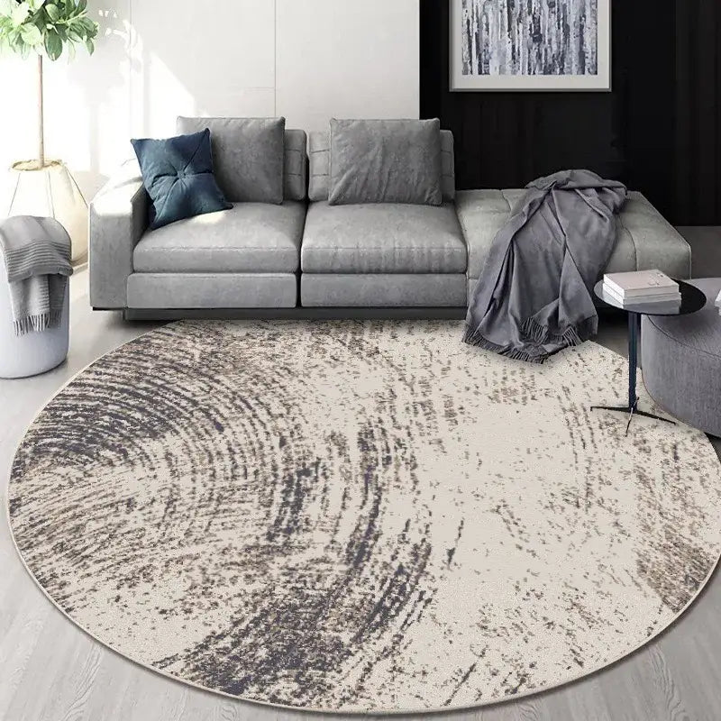 Circular geometric cashmere floor mat with textured abstract pattern in beige and dark gray for living room decorbites