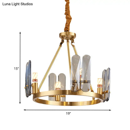 Lámpara de araña circular de latón con 4 cabezales modernistas y panel ovalado de cristal gris humo