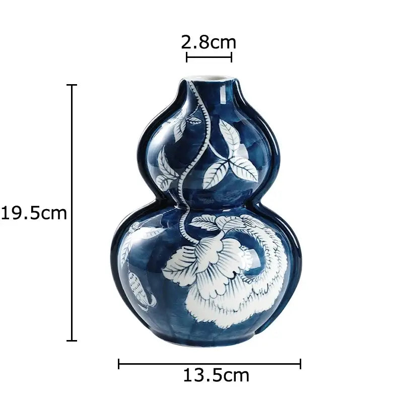 Classic blue porcelain vase with intricate white floral and leaf patterns for living room decorbites blue porcelain decor
