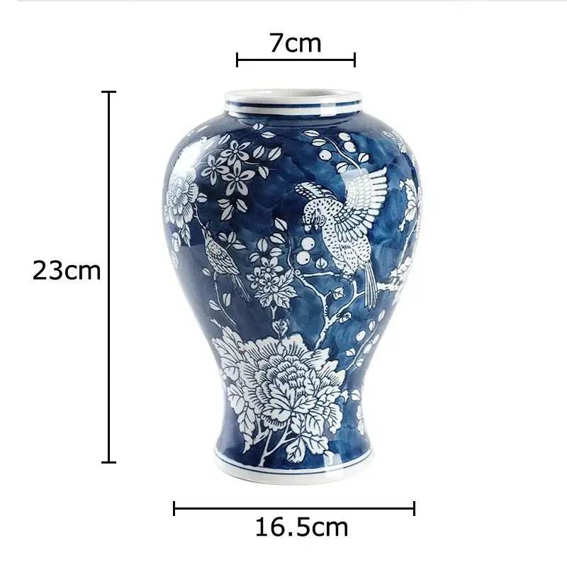Classic blue porcelain vase by decorbites featuring hand-painted birds and floral designs for living room decor