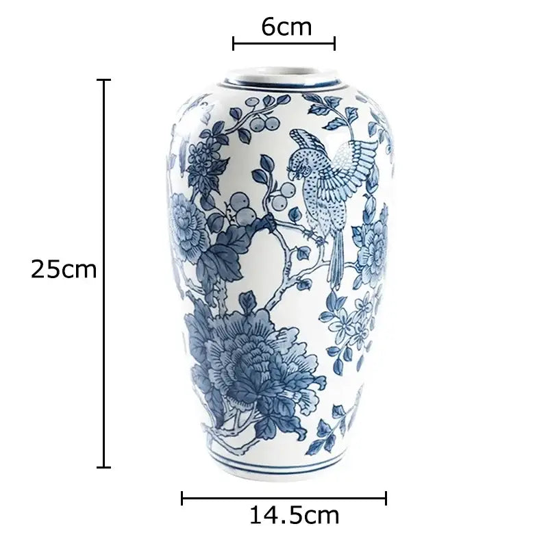 Classic blue porcelain vase with intricate hand-painted bird and floral designs for decorbites blue living room decor