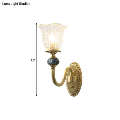 Classic Brass Floral Wall Sconce with Clear Ribbed Glass and Swooping Arm - 1/2-Head Wall Mount Lamp