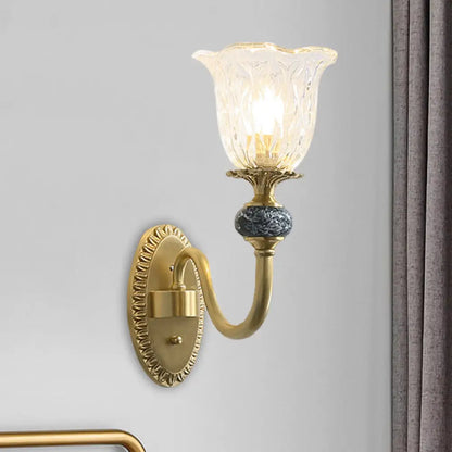 Classic Brass Floral Wall Sconce with Clear Ribbed Glass and Swooping Arm - 1/2-Head Wall Mount Lamp