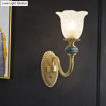Classic Brass Floral Wall Sconce with Clear Ribbed Glass and Swooping Arm - 1/2-Head Wall Mount Lamp