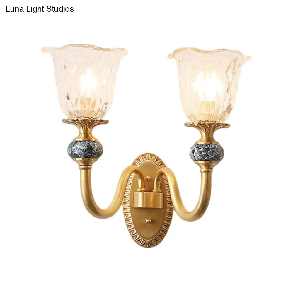 Classic Brass Floral Wall Sconce with Clear Ribbed Glass and Swooping Arm - 1/2-Head Wall Mount Lamp