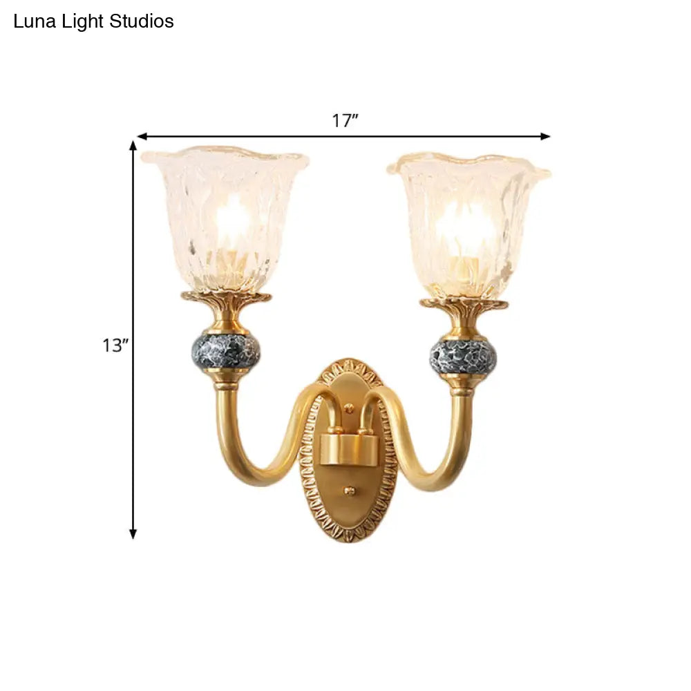 Classic Brass Floral Wall Sconce with Clear Ribbed Glass and Swooping Arm - 1/2-Head Wall Mount Lamp