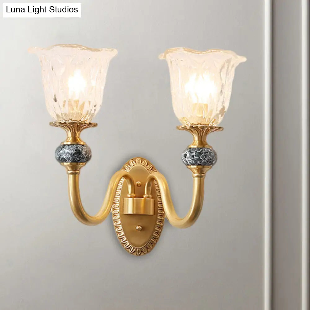 Classic Brass Floral Wall Sconce with Clear Ribbed Glass and Swooping Arm - 1/2-Head Wall Mount Lamp