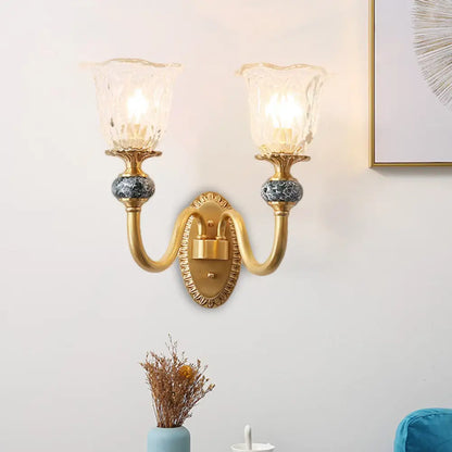 Classic Brass Floral Wall Sconce with Clear Ribbed Glass and Swooping Arm - 1/2-Head Wall Mount Lamp