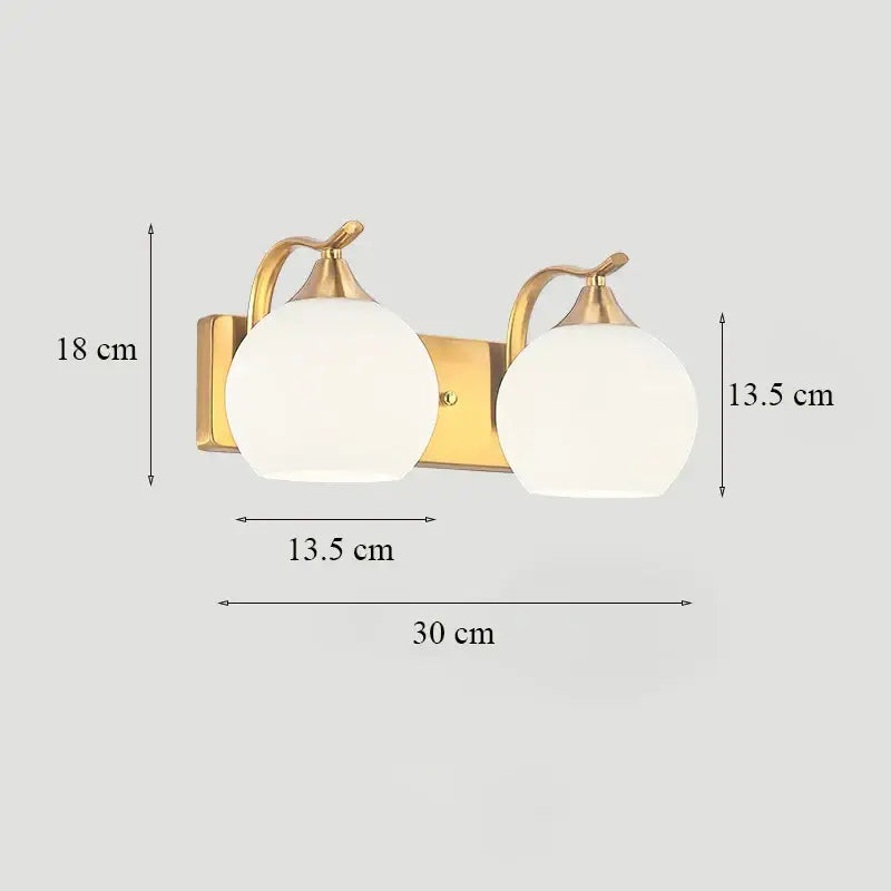 Classic brass glass wall sconce with gold-toned metal, frosted glass shades, and pear-shaped accents for bedroom decorbites brass glass