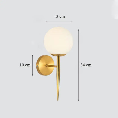 Classic brass glass wall sconce with gold-toned stem and frosted shade for bedroom decorbites brass glass wall lighting