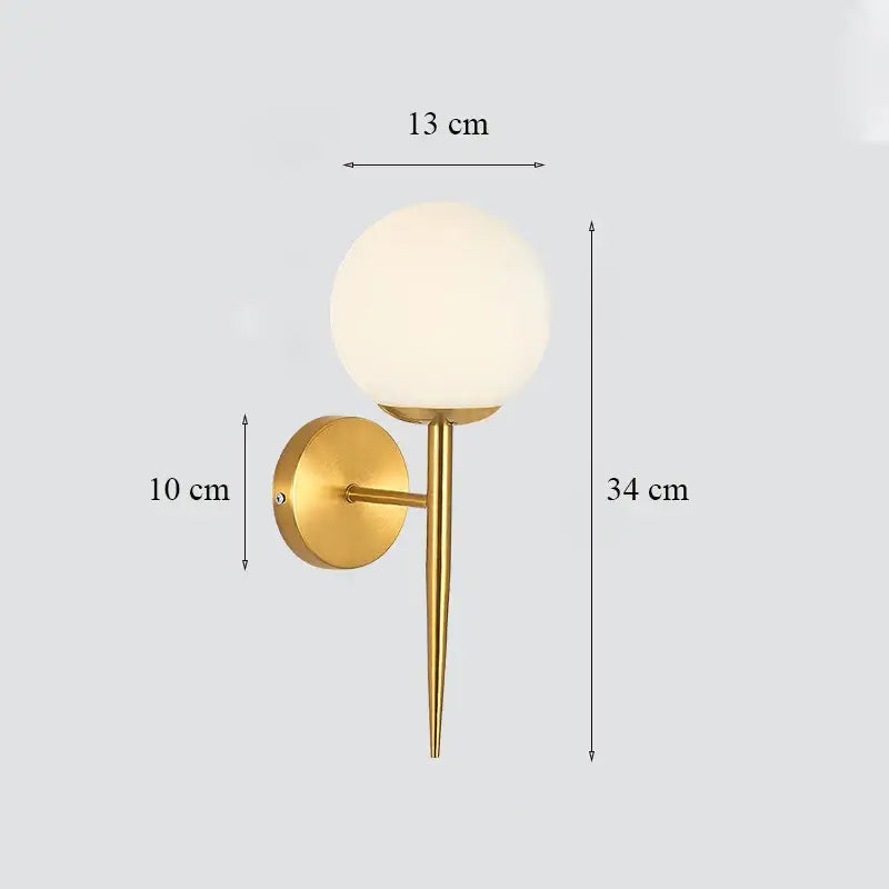Classic brass glass wall sconce with gold-toned stem and frosted shade for bedroom decorbites brass glass wall lighting