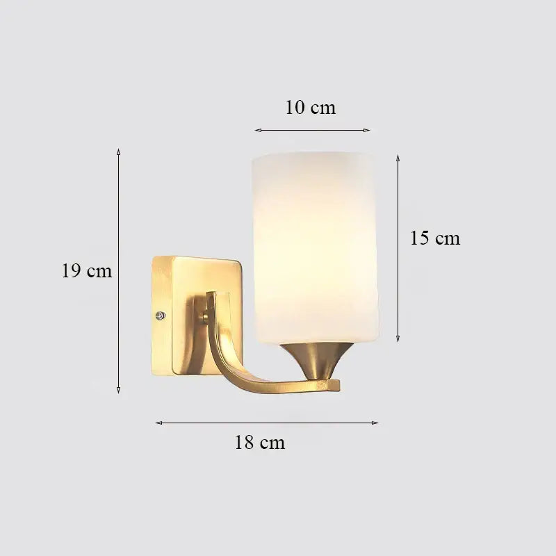 Gold-finished decorbites brass glass wall sconce with frosted glass cylinder shade for bedroom decor