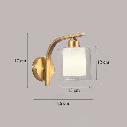 Classic brass glass wall sconce in gold tone with curved arm and frosted off-white diffuser for bedroom decorbites brass glass