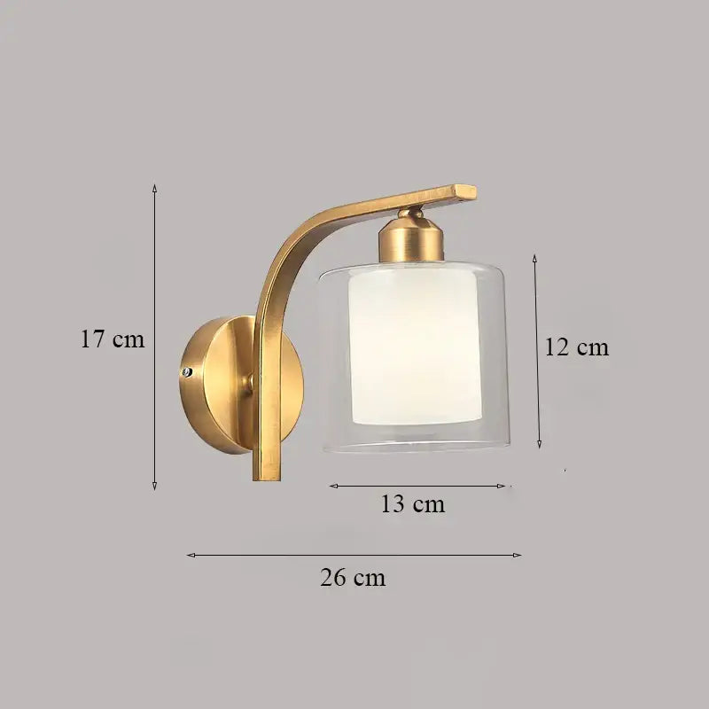Classic brass glass wall sconce in gold tone with curved arm and frosted off-white diffuser for bedroom decorbites brass glass