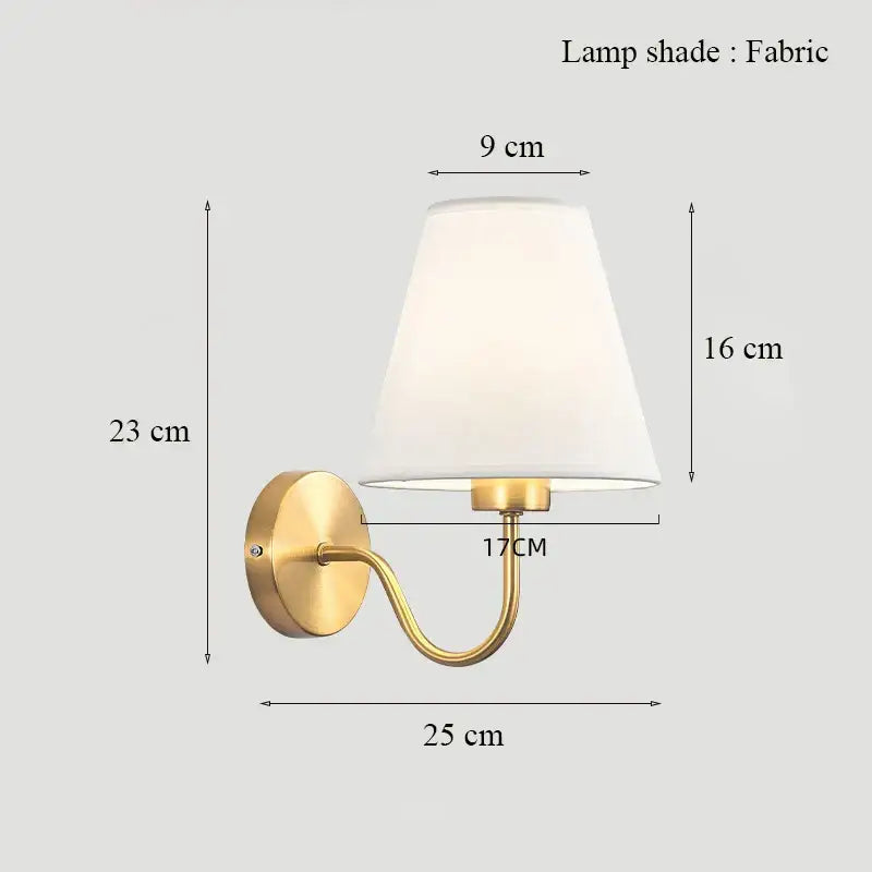 Classic brass glass wall sconce with gold-toned finish and white fabric shade for bedroom decorbites brass glass wall