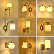 Classic brass glass wall sconce with warm-toned brass finish and frosted glass shades for bedroom decorbites brass glass wall