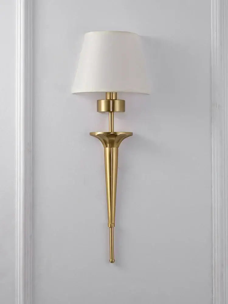 Classic gold fluted wall lamp with a white fabric shade ideal for bedroom decorbites copper wall lamp design