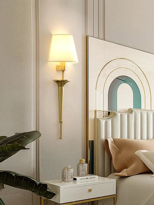 Classic gold fluted wall lamp with tapered base and soft white fabric shade perfect for bedroom decorbites copper wall lamp