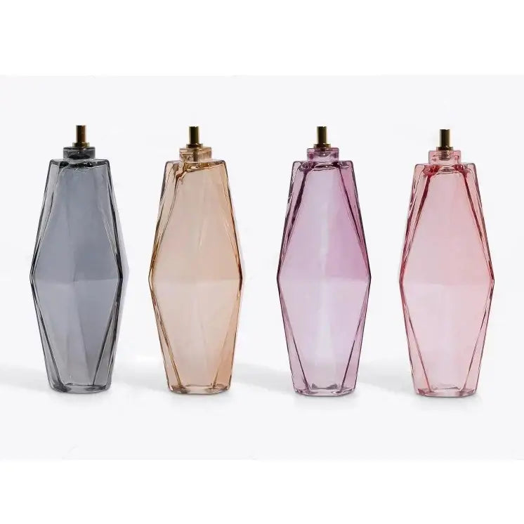 Four geometric glass perfume bottles in gray amber lavender and rose pink complement decorbites large pink glass chandelier lighting