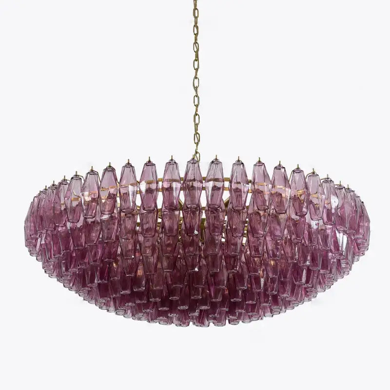 Classic pink and amber glass chandelier featuring large pink glass teardrop crystals on a brass frame for dining room decorbites large pink lighting