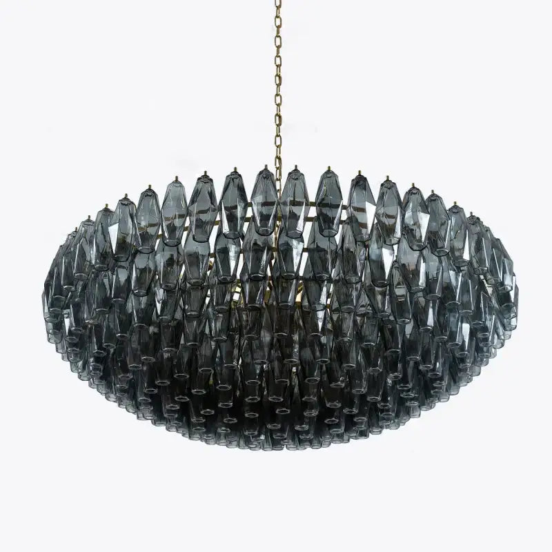 A modern oval pink glass chandelier with dark gray faceted pieces and gold chain for decorbites large pink lighting