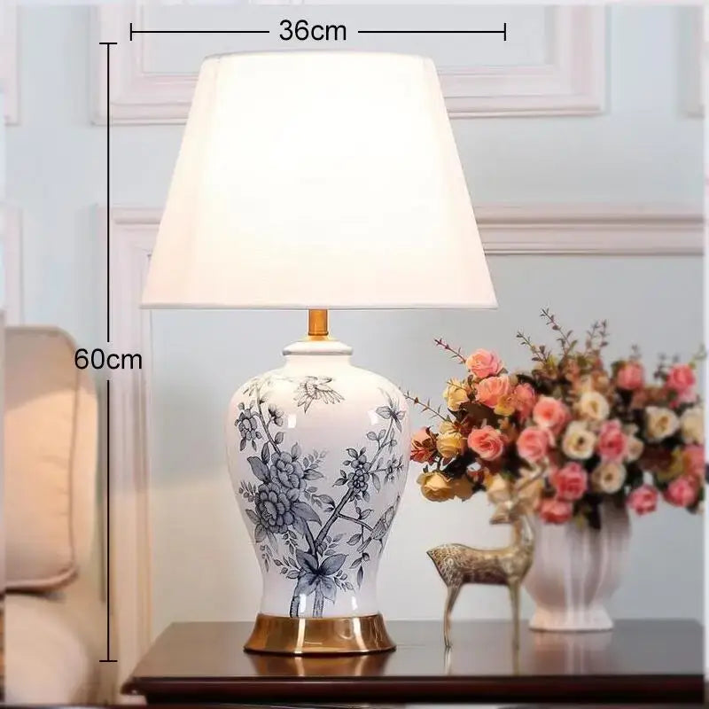 Classic white porcelain table lamp with blue floral hand-painted design and gold-toned base for living room decor