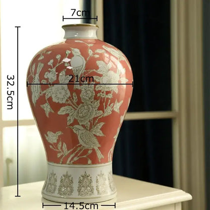 A coral-painted ceramic white porcelain vase with intricate white floral and bird motifs for decorbites blue decor