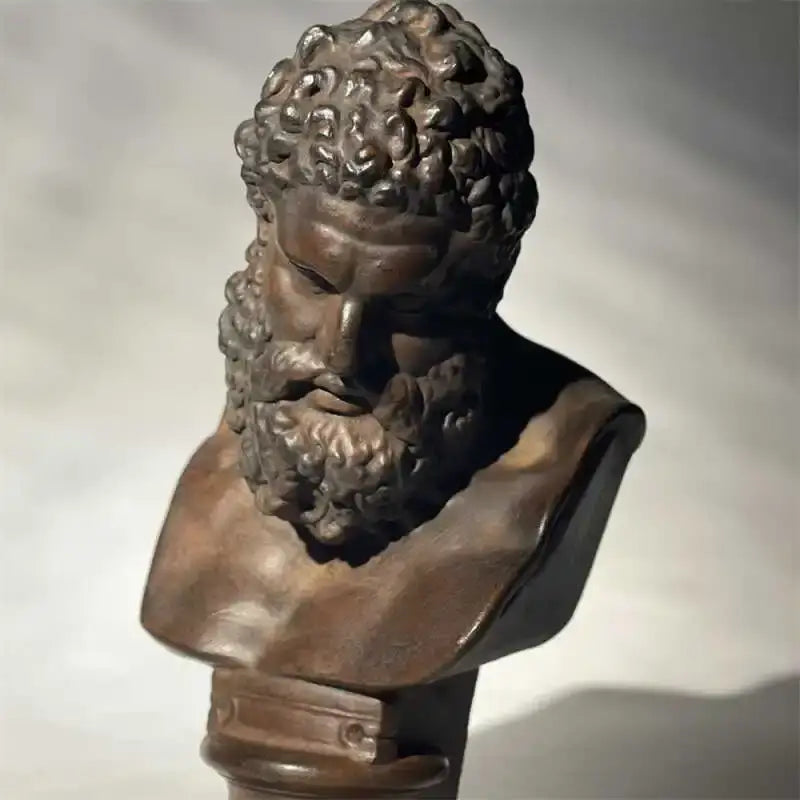 Bronze-colored classical bust sculpture of hercules with curly hair and beard on pedestal for living room decorbites art sculpture