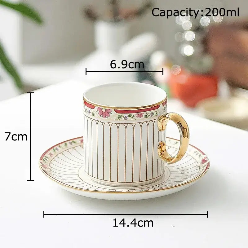 Elegant classical gold-striped ceramic cup and saucer set in white porcelain with pink floral accents for dining room use