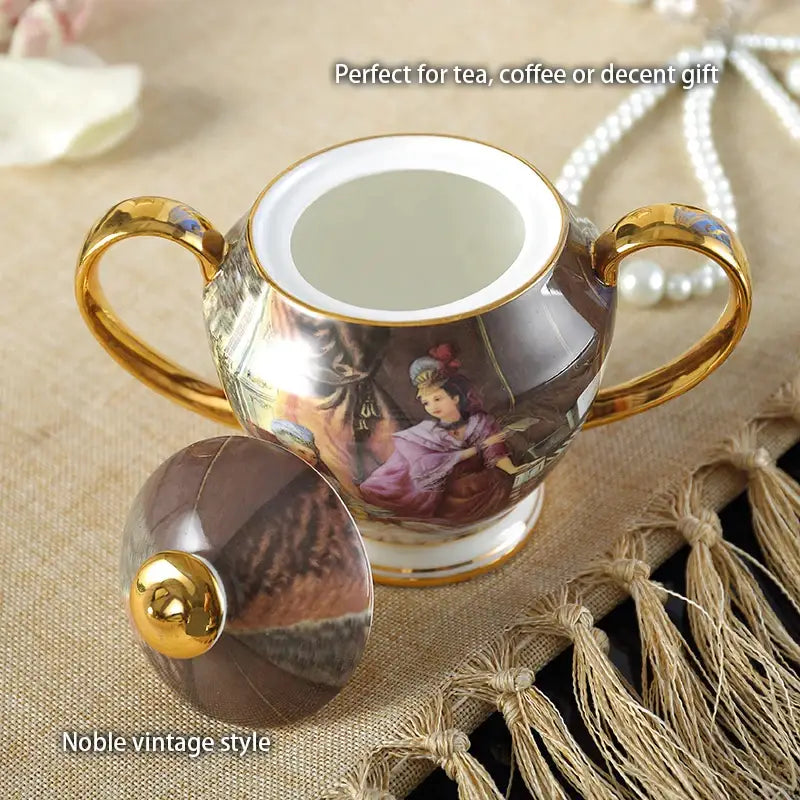 Porcelain sugar bowl with gold-trimmed handles and vintage woman painting in