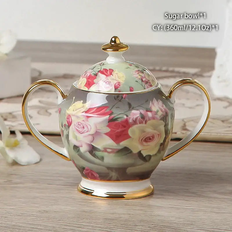 Classical gold trimmed bone china sugar bowl with floral rose design in soft pinks and creams in a creamer set