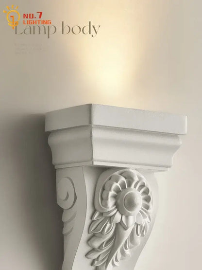 Classical ornate white cream resin wall lamp with floral relief design for elegant living room decorbites cream resin decor