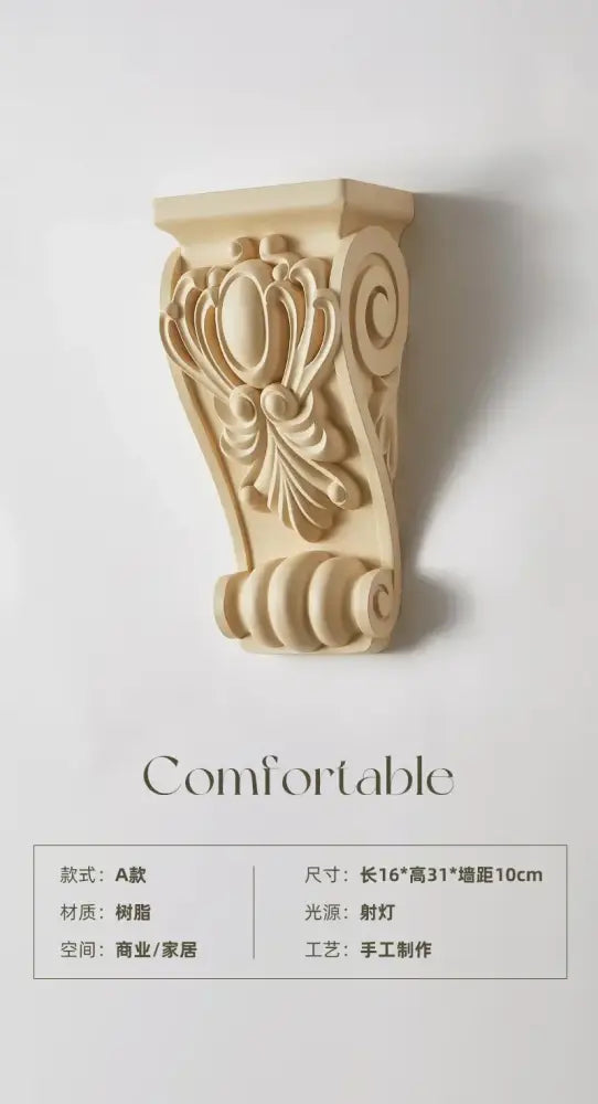 A light beige intricately carved corbel for decorbites cream resin wall lamp with ornate floral and scrollwork details