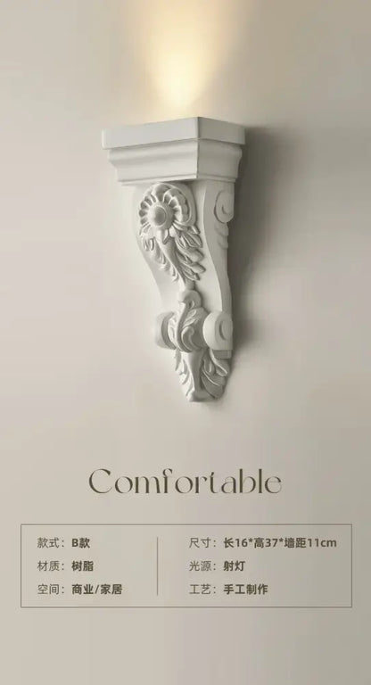 Classical ornate white cream resin wall lamp with floral and scrollwork decorbites cream resin corbel design
