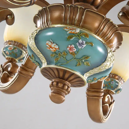 Classical resin chandelier bronze and turquoise with hand-painted floral motifs and gold-trimmed edges by decorbites classical
