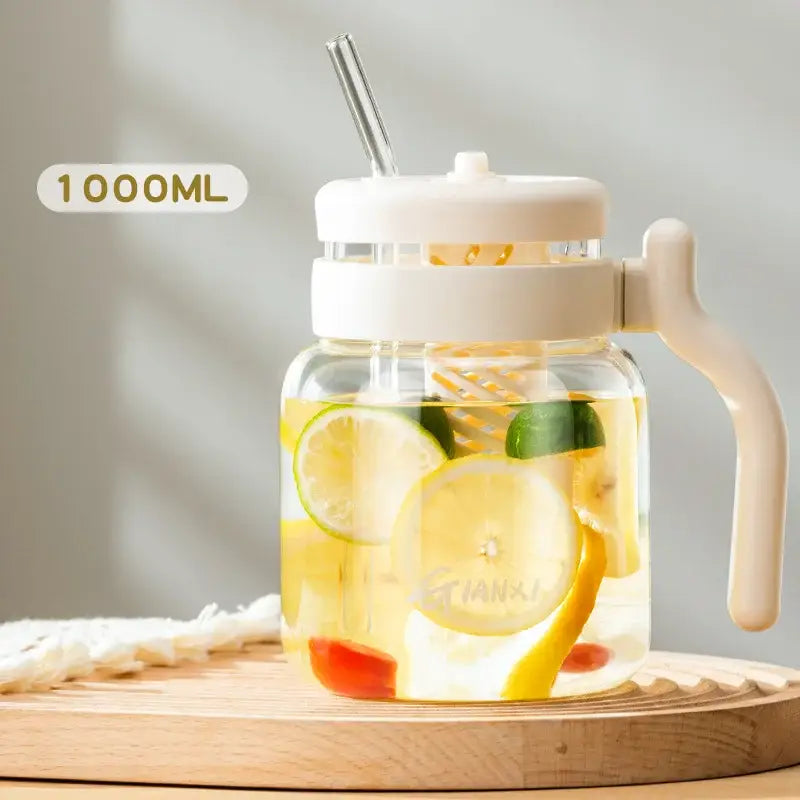 Clear 1000ml glass tumbler with handle and straw filled with lemon-infused water for kitchen use decorbites 1000ml glass