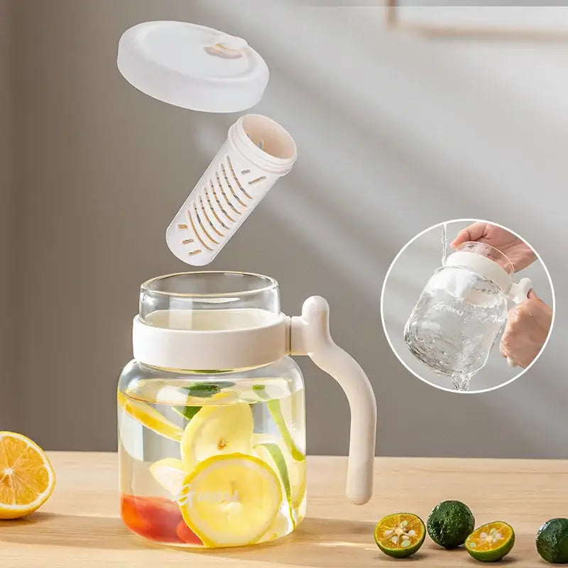 Clear 1000ml glass tumbler with handle and straw featuring a clear glass pitcher with white lid and removable infuser