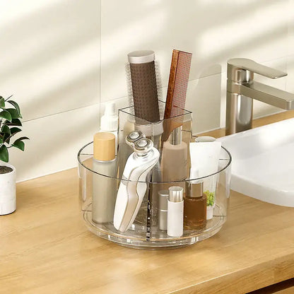 Clear 3 tier rotating acrylic makeup organizer in clear acrylic with multiple compartments for grooming storage